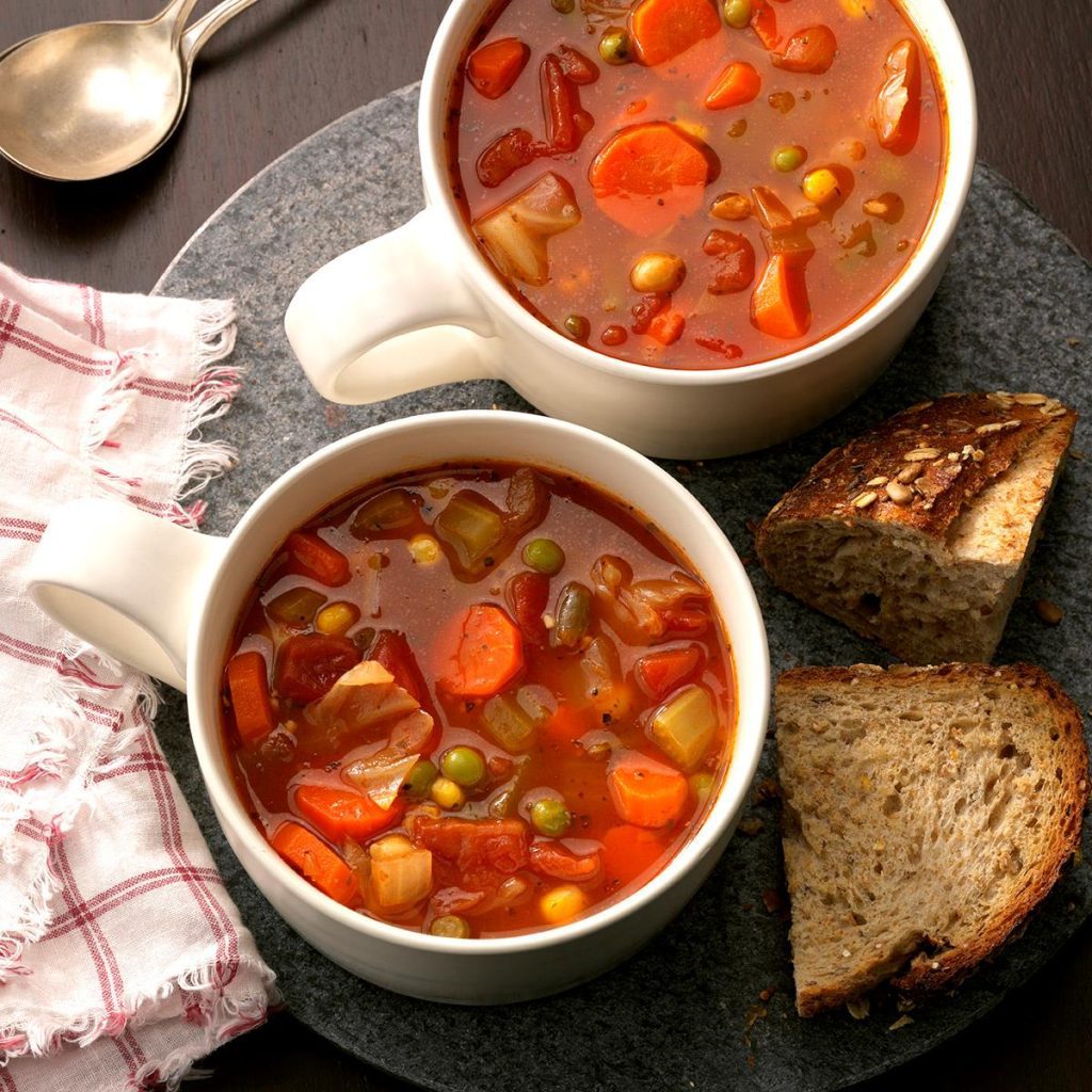 vegetable soup served in cups with bread